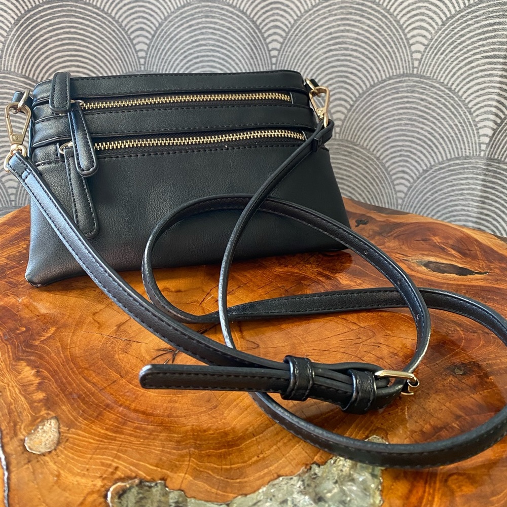 Black with gold accent over the shoulder bag